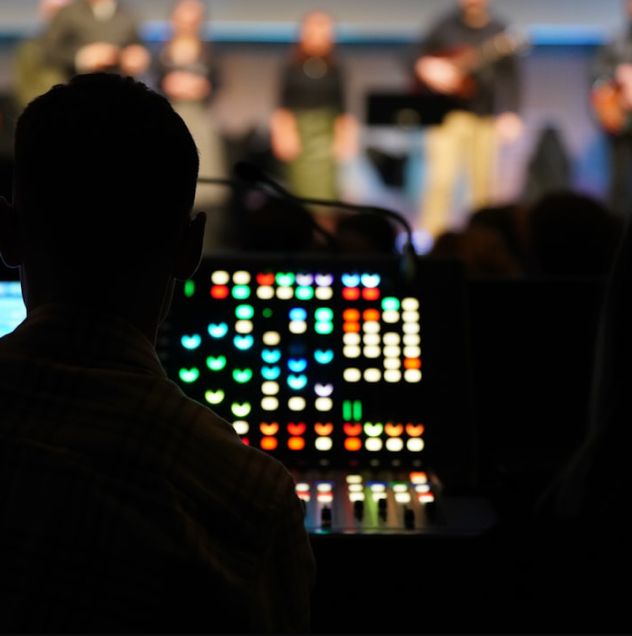 Editor working at a lighting control board